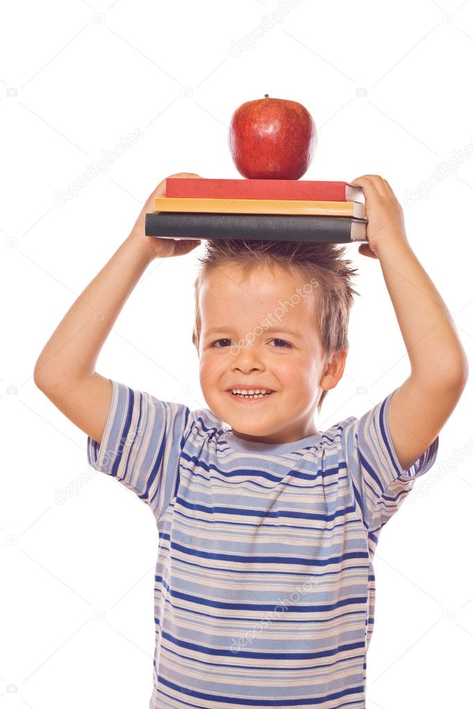 Playing with school books and apple