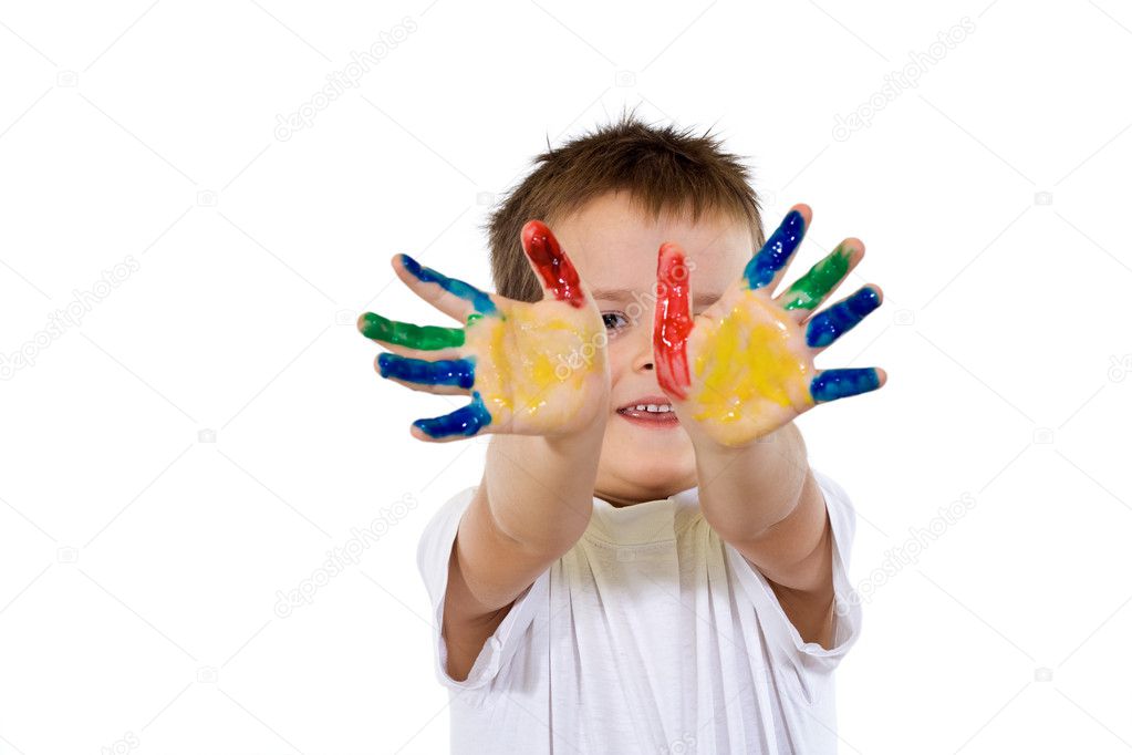 Smiling proud boy with hands full of paint