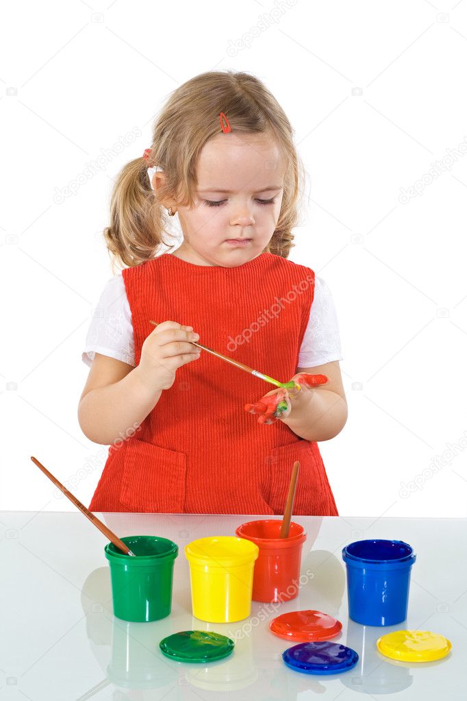 Serious girl with painting kit