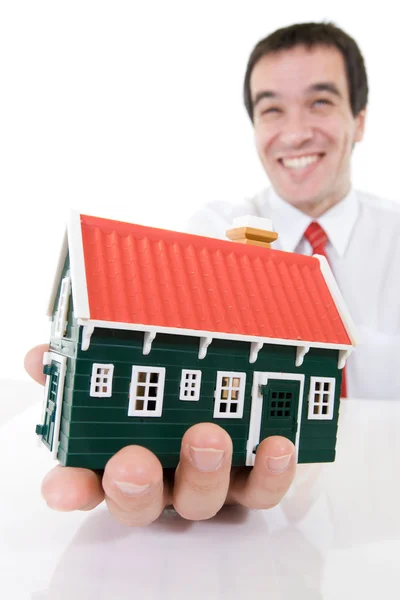 Imprenditore estatico con una casa in miniatura — Foto Stock