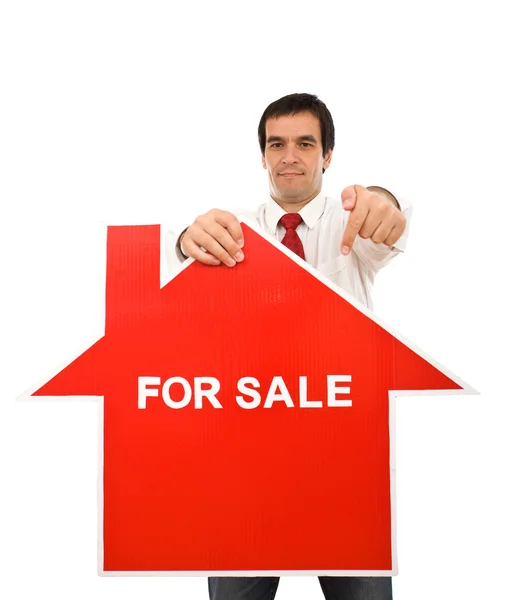 Concepto inmobiliario con agente mostrando signo — Foto de Stock