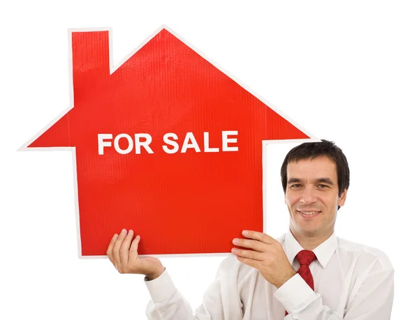 Πωλητής με σπίτι πινακίδα "πωλείται" — Φωτογραφία Αρχείου