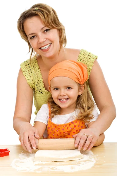 Happy girls stretching the dough — Stock Photo, Image