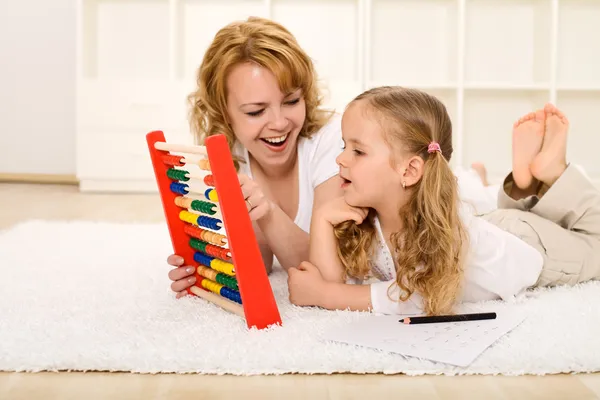Doing math exercises with mom — Stock Photo, Image