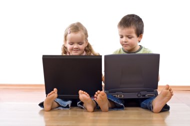 Kids using laptop computers clipart