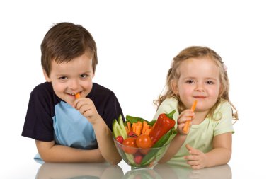 Happy kids eating vegetables clipart