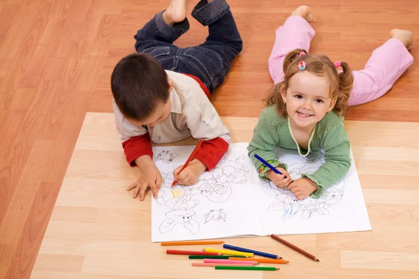 Happy kids coloring the tale book — Zdjęcie stockowe
