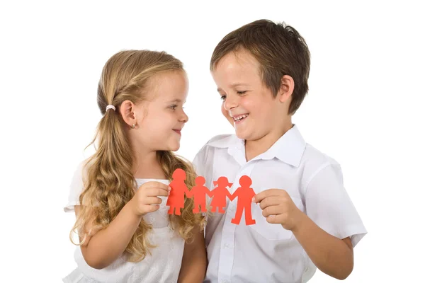 Happy smiling kids holding paper - isolated — Stock Photo, Image