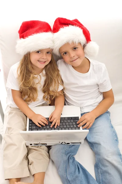 stock image Kids with laptop ordering christmas presents