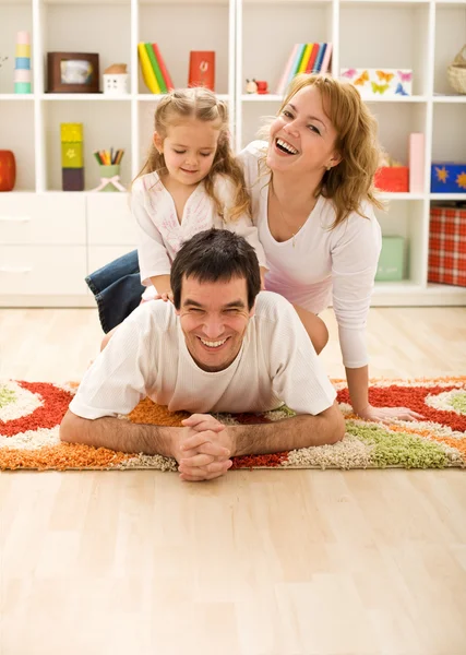 Happy family in the kids room — Stock Photo, Image