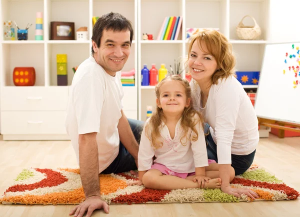 Happy family together sitting on the floor — Stock Photo, Image