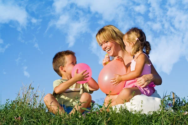 Woman and her kids playing — Stock Photo, Image