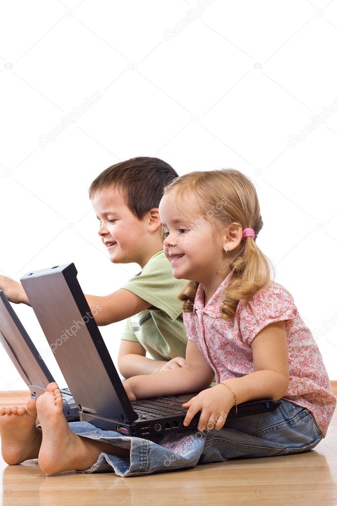 Kids playing on laptops