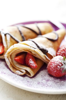 Crepes with strawberries clipart