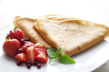 Crepes with strawberries clipart