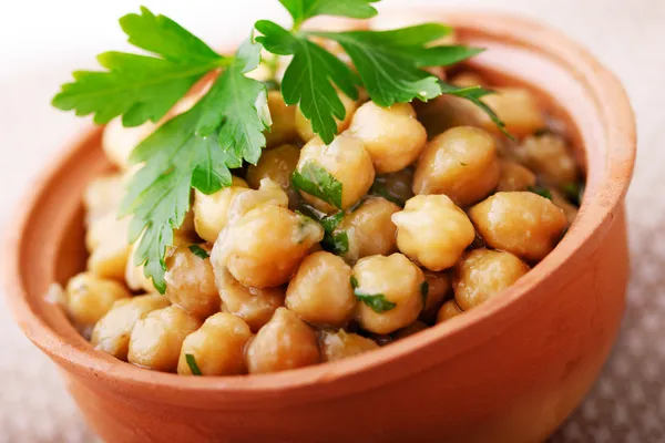 Chickpeas in sauce with parsley — Stock Photo, Image