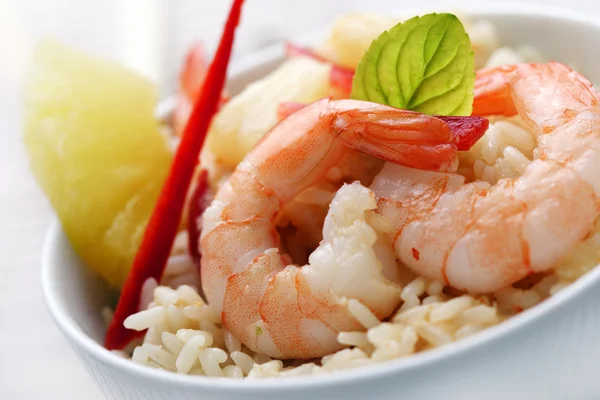 Closeup of shrimps with pineapple,red pepper and rice, red curry,coconut an — Stock Photo, Image