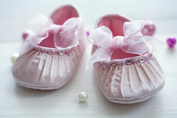 Stock image Cute silk baby shoes