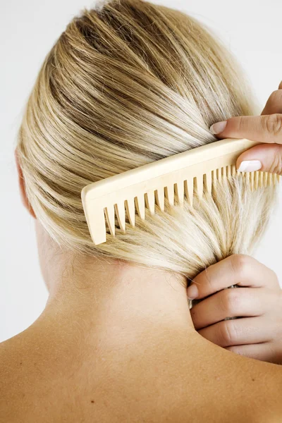 stock image Combing hair