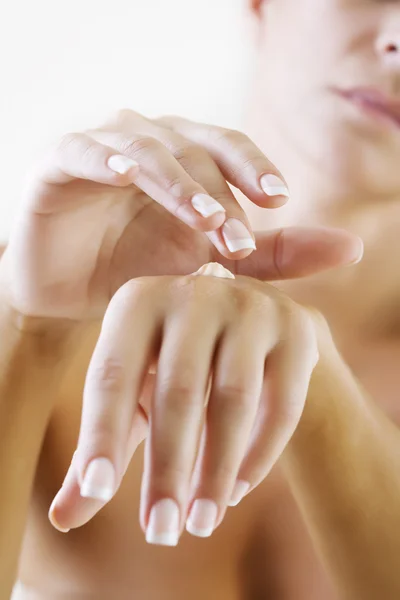 Applying hand lotion — Stock Photo, Image