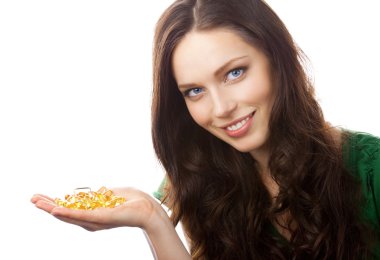 Portrait of woman showing Omega 3 fish oil capsules, isolated on clipart