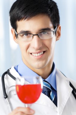 Happy smiling doctor with red wine, at office clipart