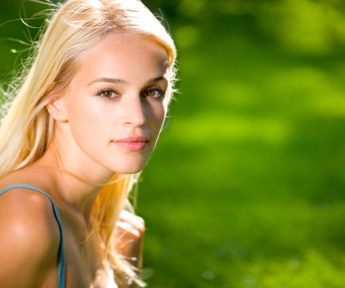 Portrait of young beautiful sexy smiling woman outdoors clipart