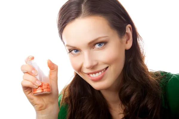 Portretul unei femei zâmbitoare fericite care arată sticlă cu pastile, isola — Fotografie, imagine de stoc