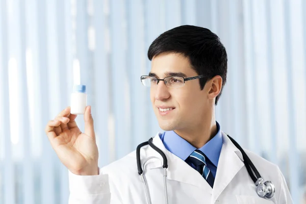 Happy doctor with drug, at office — Stock Photo, Image