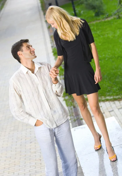 Young happy amorous couple together, outdoors — Stock Photo, Image