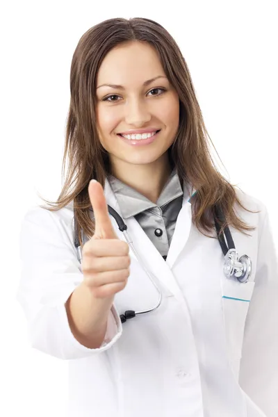 Glückliche Ärztin mit erhobenem Daumen, isoliert auf weiß Stockbild
