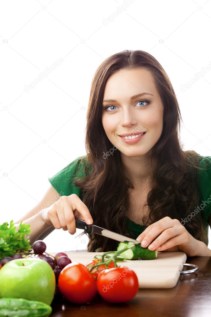 Portrait of happy smiling woman cooking with vegetarian food, is