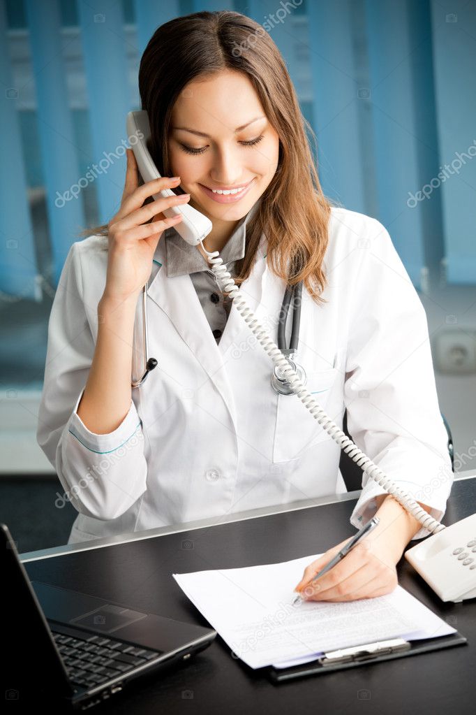 Young happy smiling successful female doctor