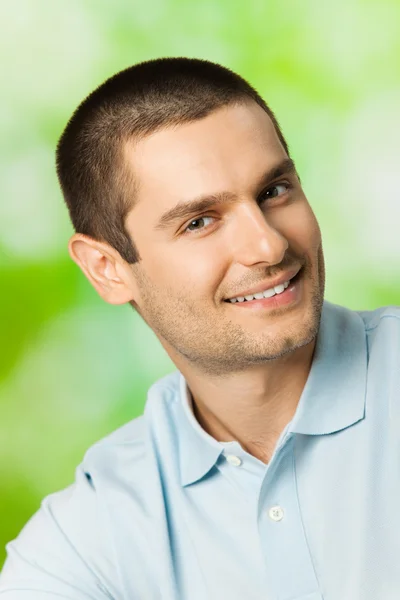 Portrait of young happy smiling attractive man, outdoors — Stock Photo, Image