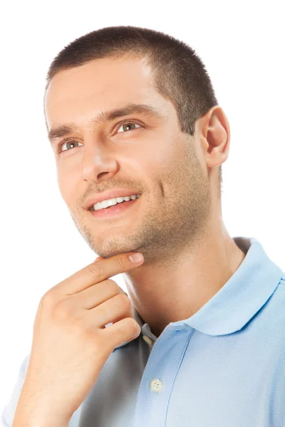 Porträt eines denkenden Mannes, aufblickend, lächelnd, isoliert auf weiß lizenzfreie Stockbilder