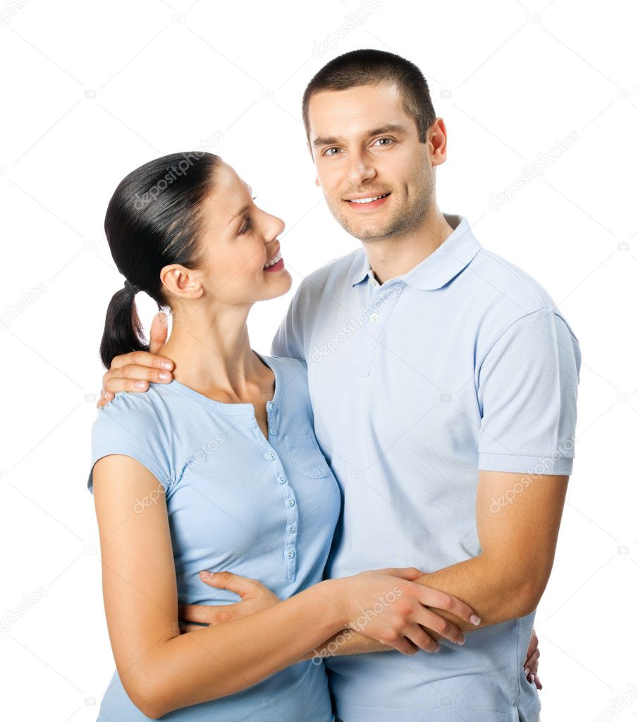 Portrait of young happy smiling attractive couple, isolated on w