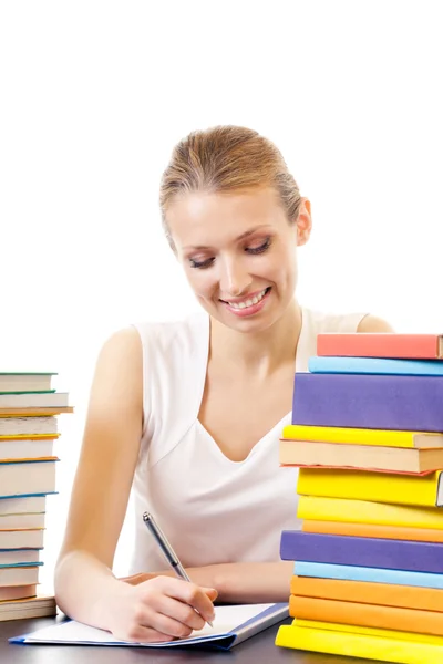 Schreibende Frau mit Schulbüchern, isoliert auf weiß — Stockfoto