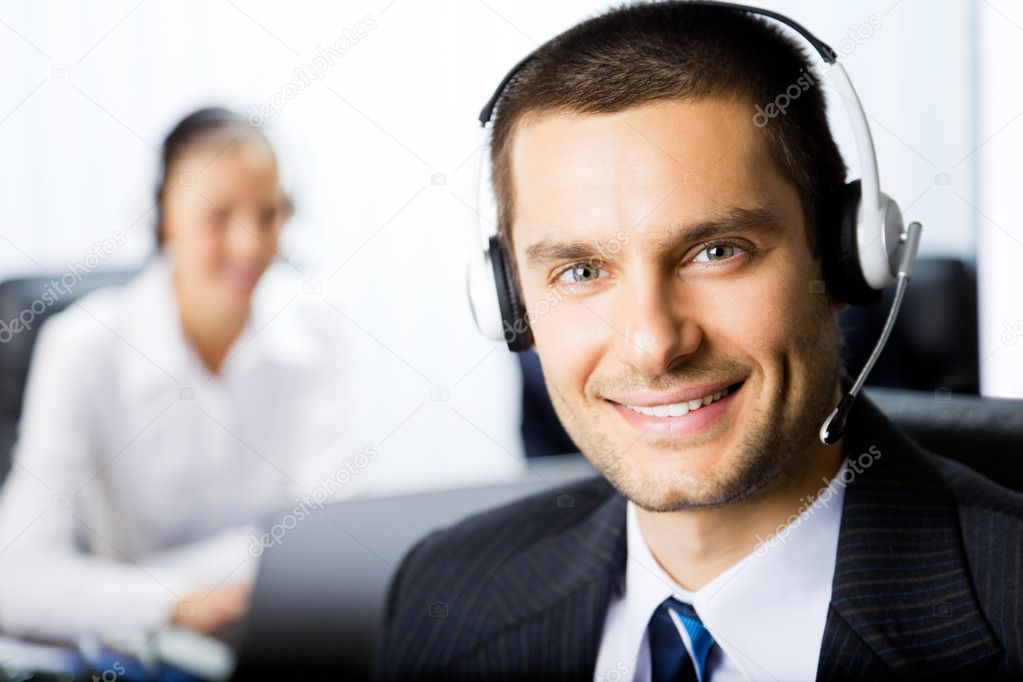 Two support phone operators at workplace