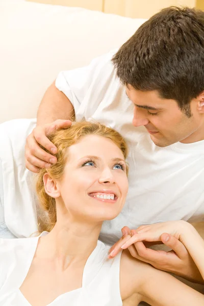 Portrait of young happy amorous couple at home — Stock Photo, Image