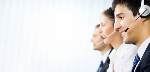 Three customer support phone operators at office — Stock Photo, Image