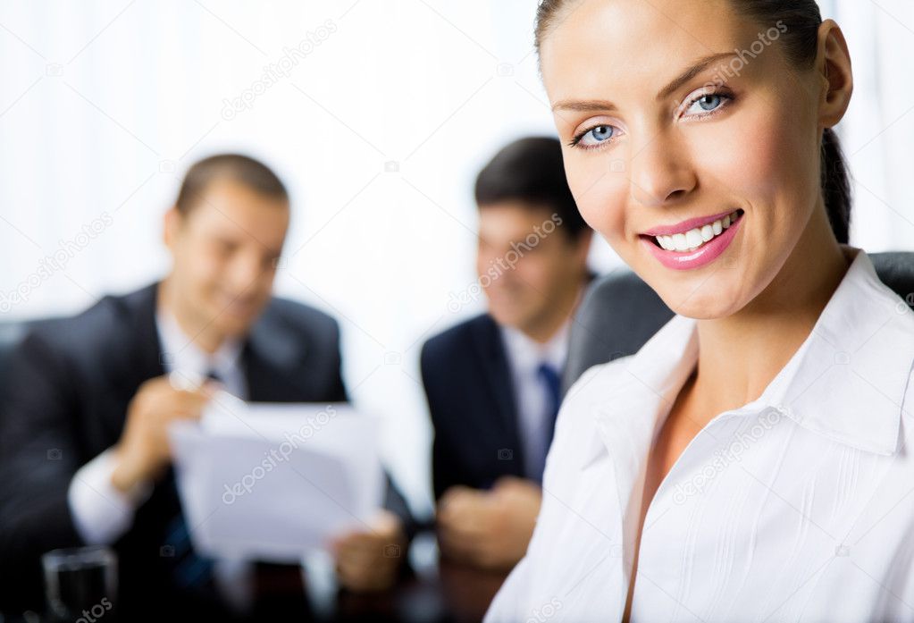 Business woman and colleagues at office