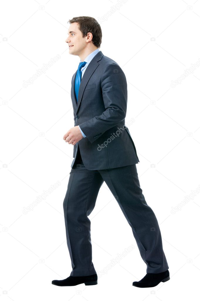 Full body portrait of walking businessman, isolated on white bac