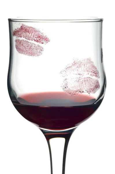 Kuss auf Glas mit Wein lizenzfreie Stockbilder