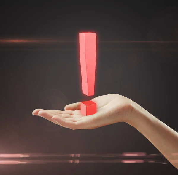 Rött utropstecken på en kvinnas hand — Stockfoto