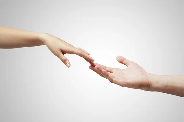 Male and female hands (palms) stretch to each other — Stock Photo, Image