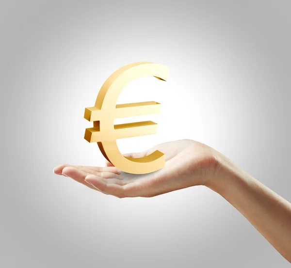 3D altın Euro simgesi üzerinde bir kadın eli — Stok fotoğraf