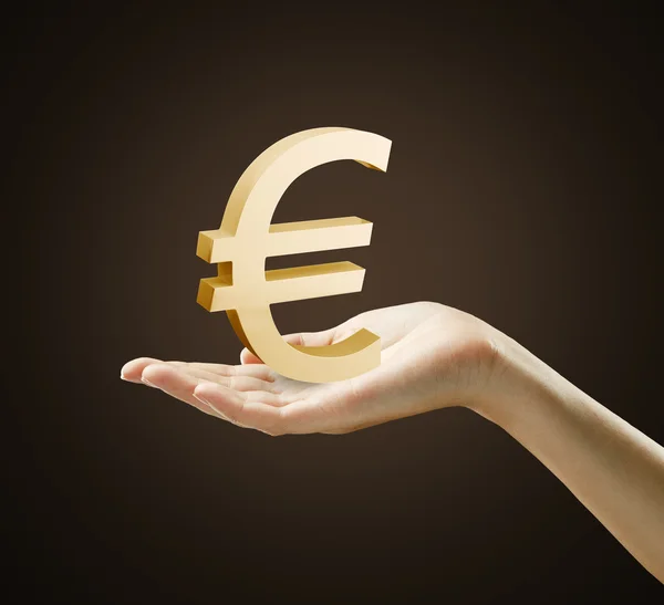 3d ouro euro assinar na mão de uma mulher — Fotografia de Stock