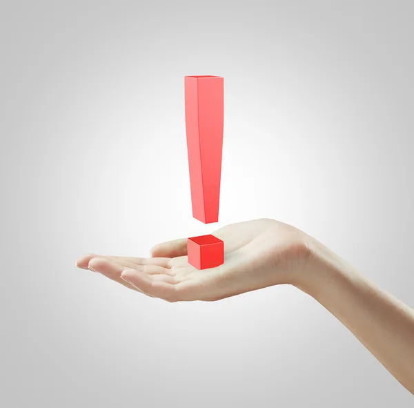 Red exclamation mark on a woman's hand — Stock Photo, Image