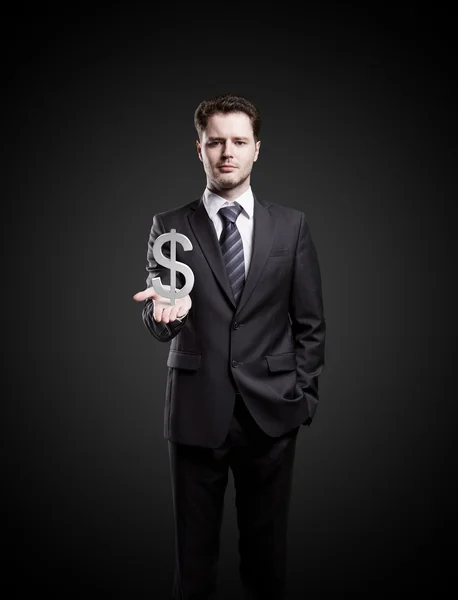 Jonge zakenman kiest ons dollarteken een groene — Stockfoto