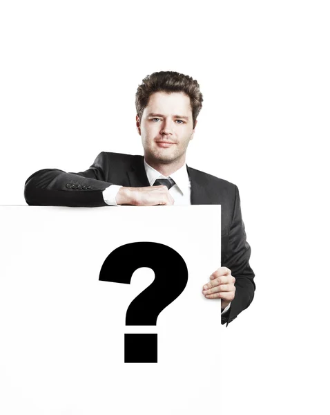 Jungunternehmer hält ein weißes Brett mit einem Fragezeichen — Stockfoto